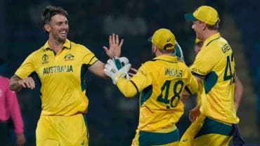 Mitchell Marsh celebrates with his teammates after taking a wicket